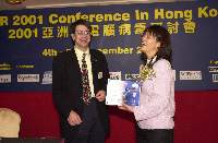 Eva Chen (Right) is presented with a souvenier by Allan Dyer